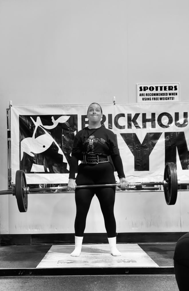 A photo of Hannah Humphreys holding a barbell